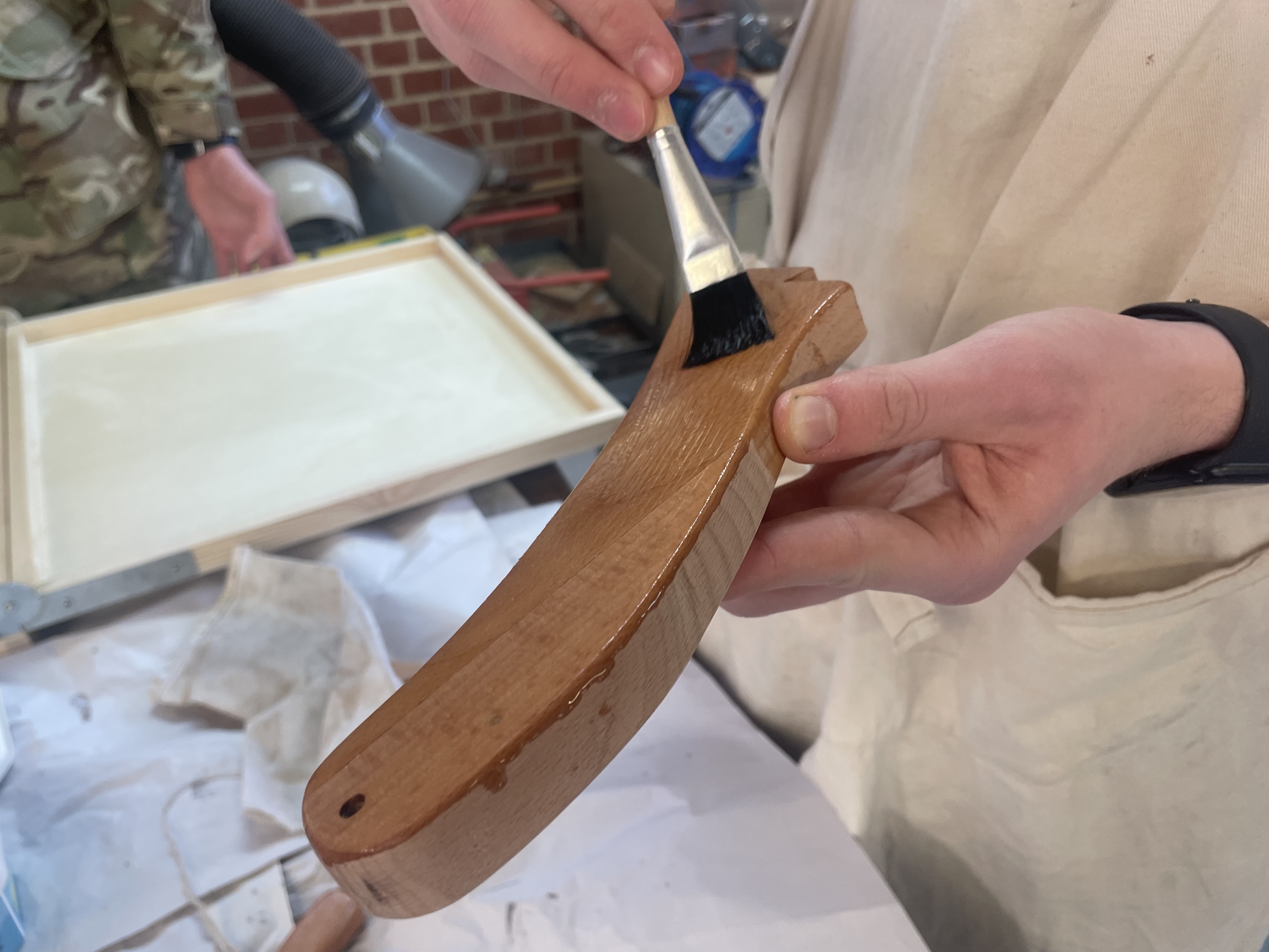 Applying Danish oil to the tail piece