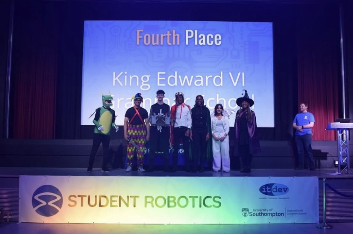 Team on stage receiving Fourth Place at Student Robotics 2026